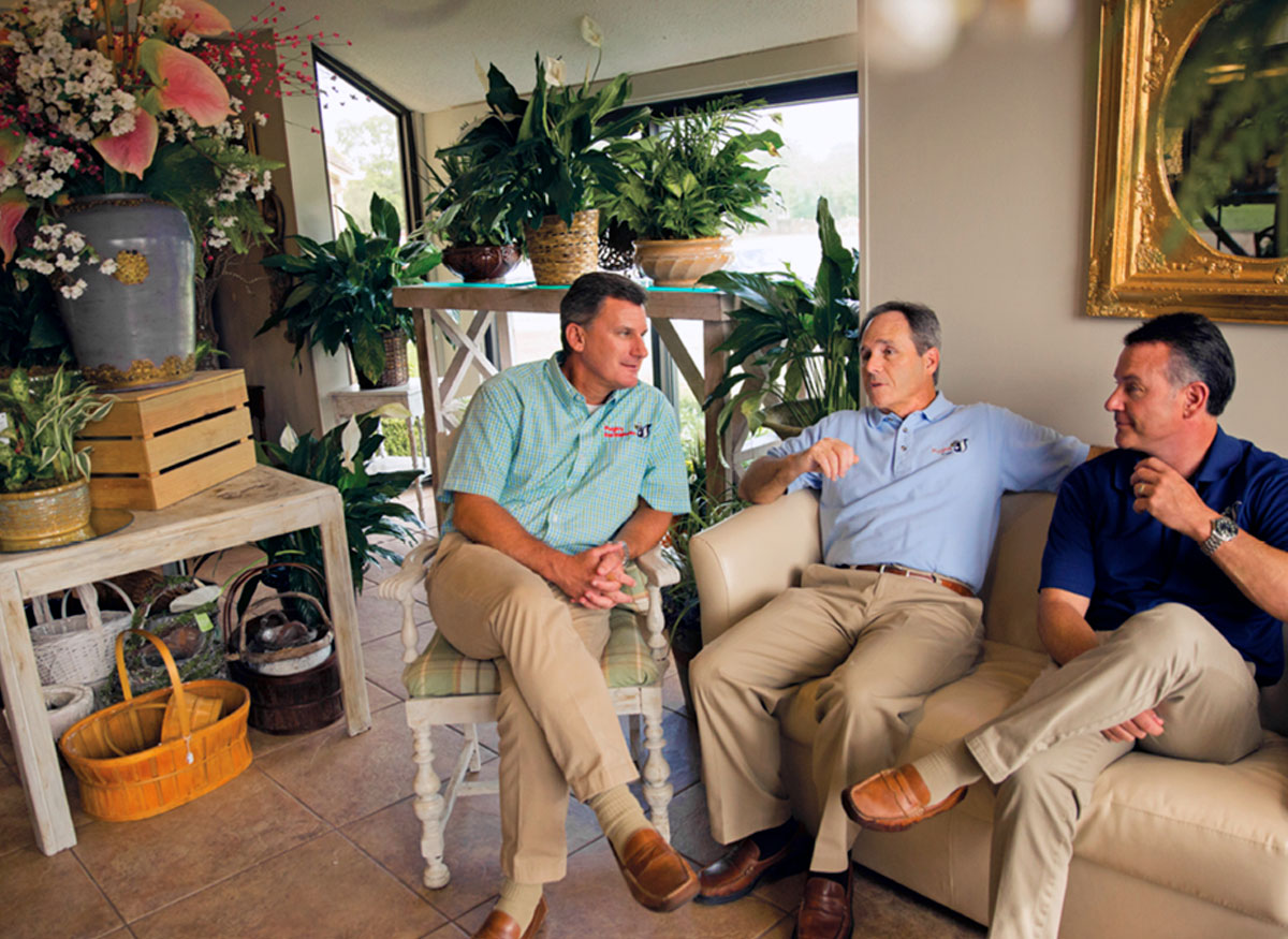 Our three owners, discussing strategy inside the store